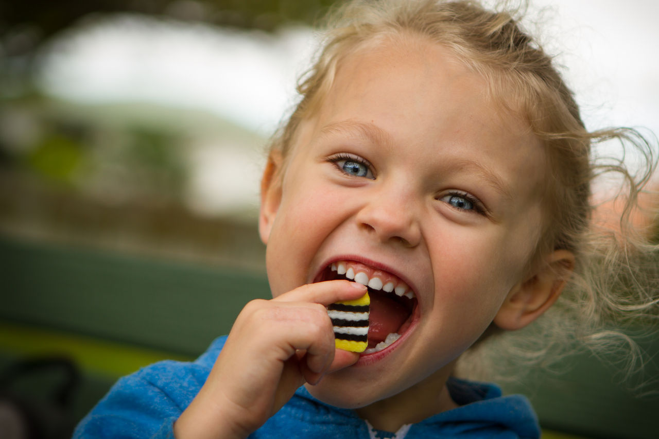 young child eating sweets
