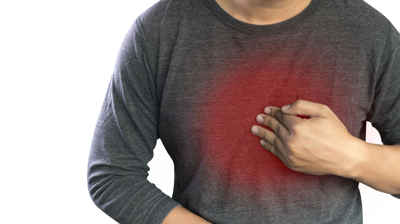 MAN with symptomatic acid reflux , suffering from acid reflux at park,MAN with symptomatic acid reflux , suffering from acid reflux at