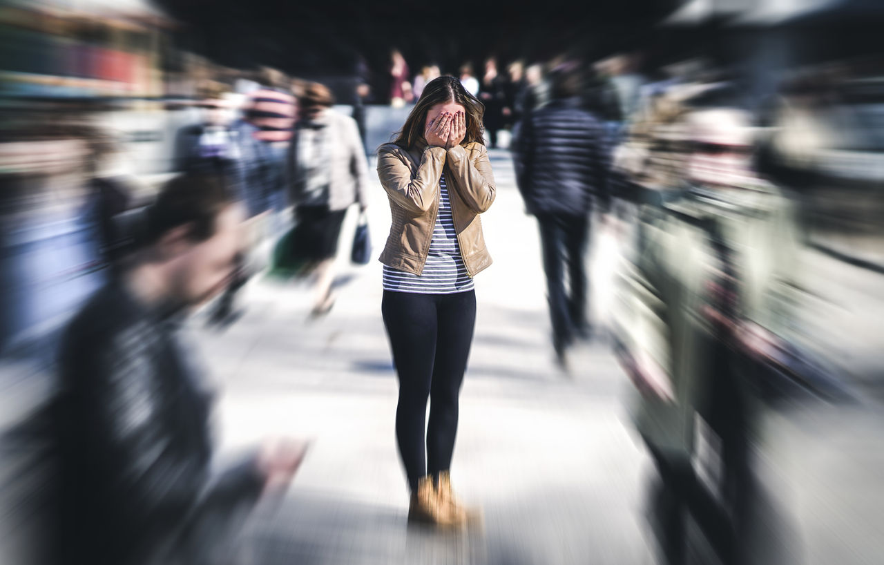 Panic attack in public place. Woman having panic disorder in city. Psychology, solitude, fear or mental health problems concept. Depressed sad person surrounded by people walking in busy street.,Panic attack in public place. Woman having panic disorder in cit