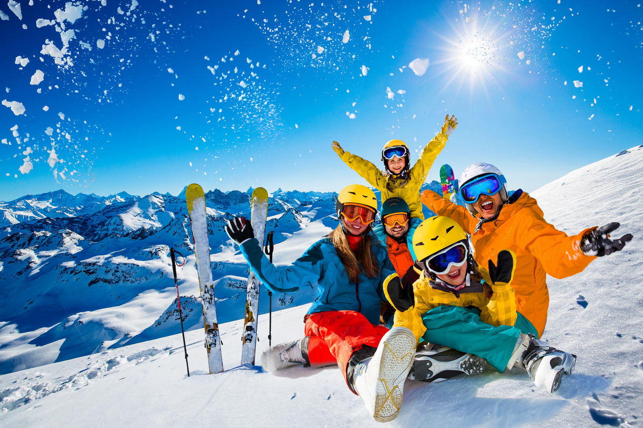 Happy family enjoying winter vacations in mountains. Playing with snow, Sun in high mountains. Winter holidays.,Happy family enjoying winter vacations in mountains. Playing wit