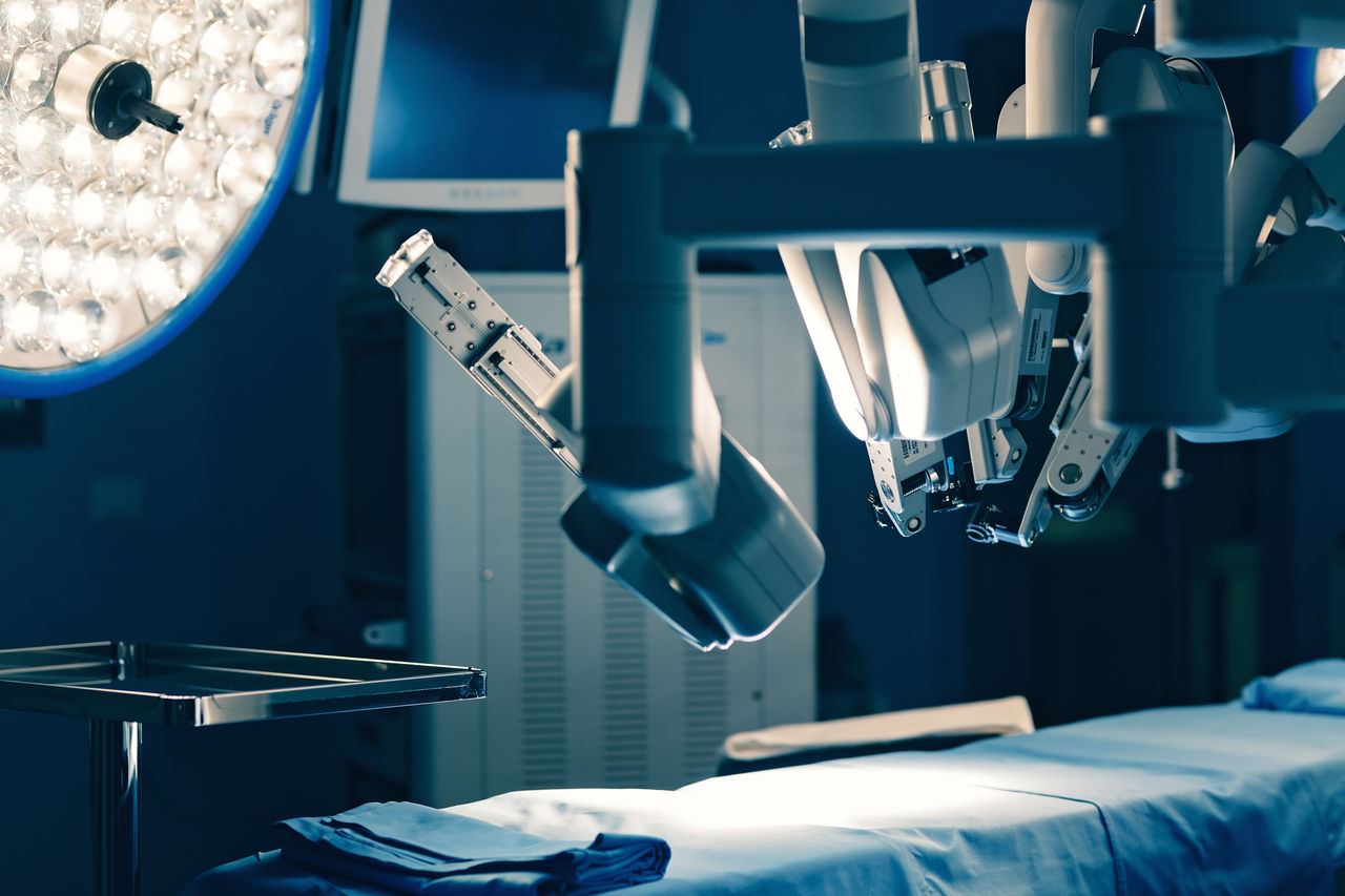 Surgical room in hospital with robotic technology equipment, machine arm surgeon in futuristic operation room. Minimal invasive surgical inoovation, medical robot surgery with 3D view endoscopy,Surgical room in hospital with robotic technology equipment, mac