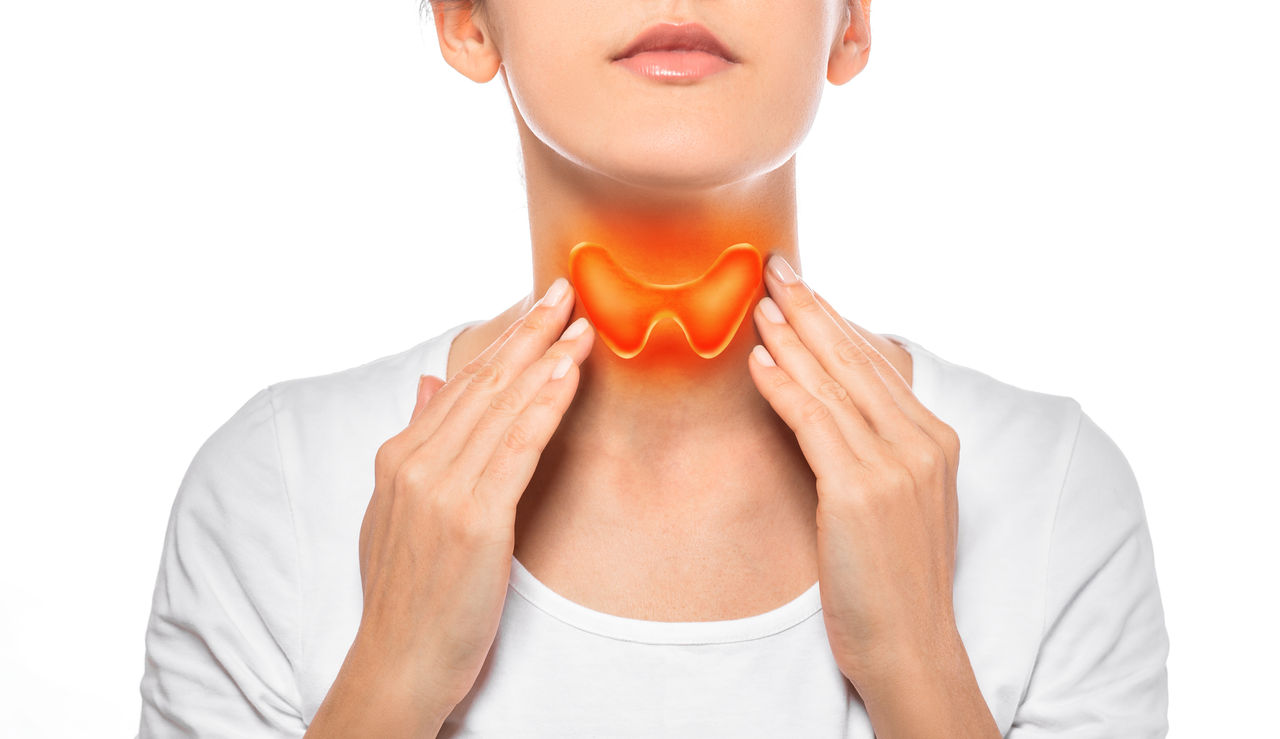 Woman showing painted thyroid gland on her neck. Enlarged butterfly-shaped thyroid gland, isolated on white background,Woman showing painted thyroid gland on her neck. Enlarged butter