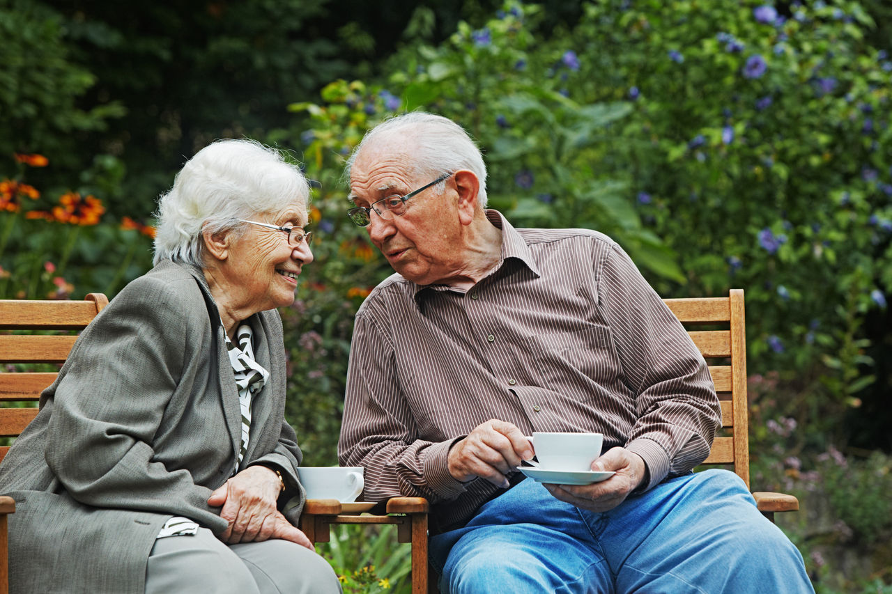 aged couple on the garden bench