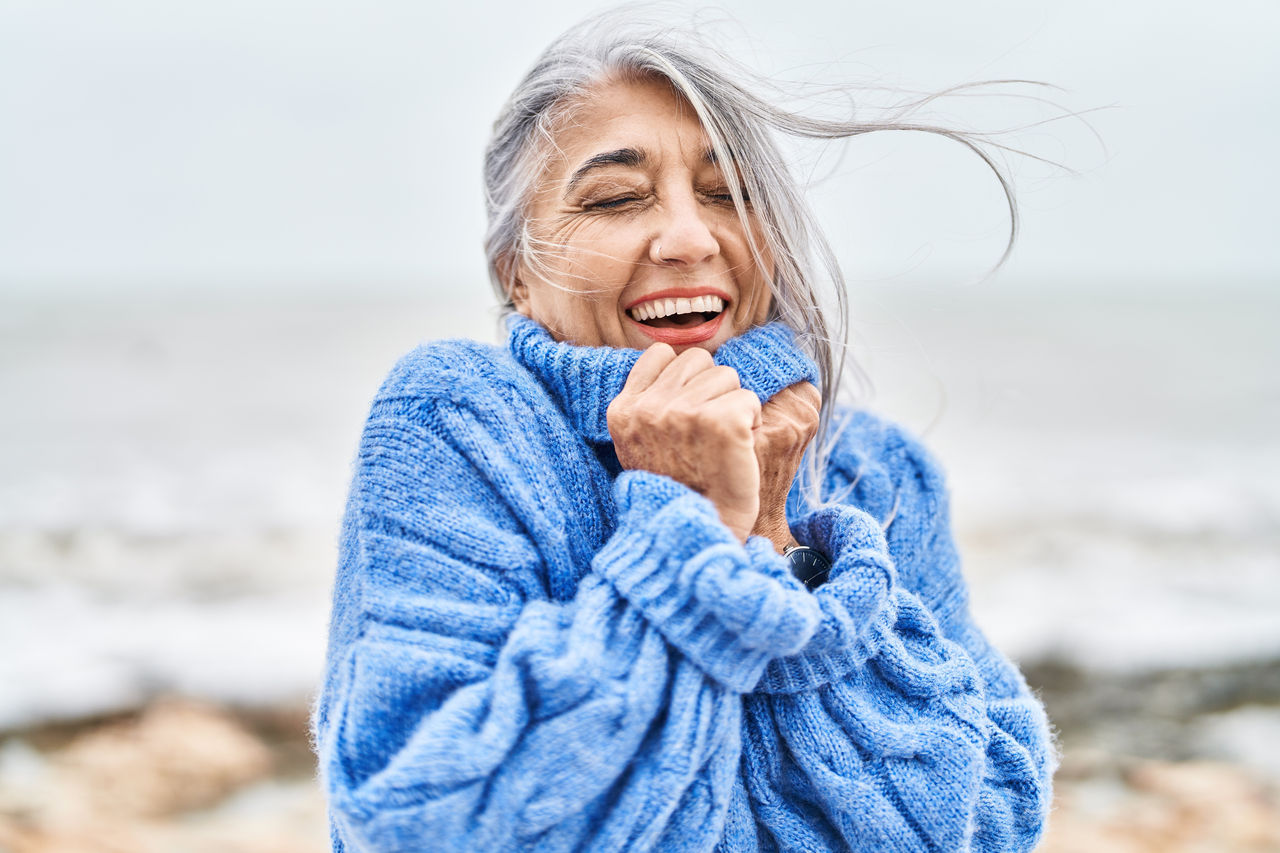 Middle age grey-haired woman smiling confident standing at seaside,Middle age grey-haired woman smiling confident standing at seasi